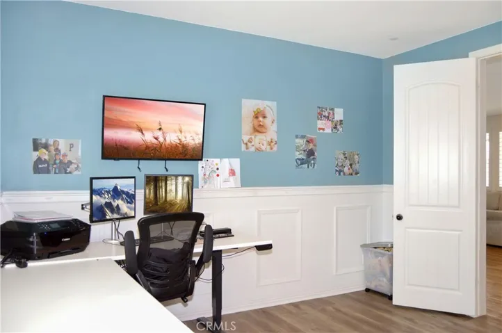 This attractive main floor office with double-door entry and stylish wainscoting can serve so many purposes. It can be a formal dining room, den, extra bedroom, or ?