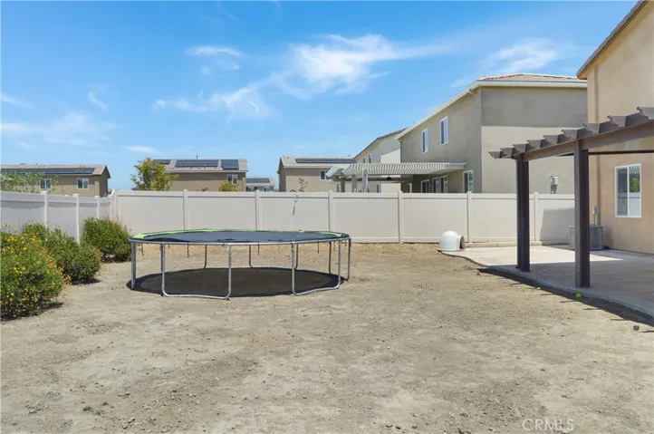 What a great backyard with an expansive stamped concrete patio partially covered by an AlumaWood cover with fans and recessed lighting and a nearly blank slate to landscape to your taste. Yes, this is a premium, pool-sized lot!