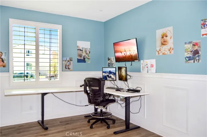 This attractive main floor office with double-door entry and stylish wainscoting can serve so many purposes. It can be a formal dining room, den, extra bedroom, or ?