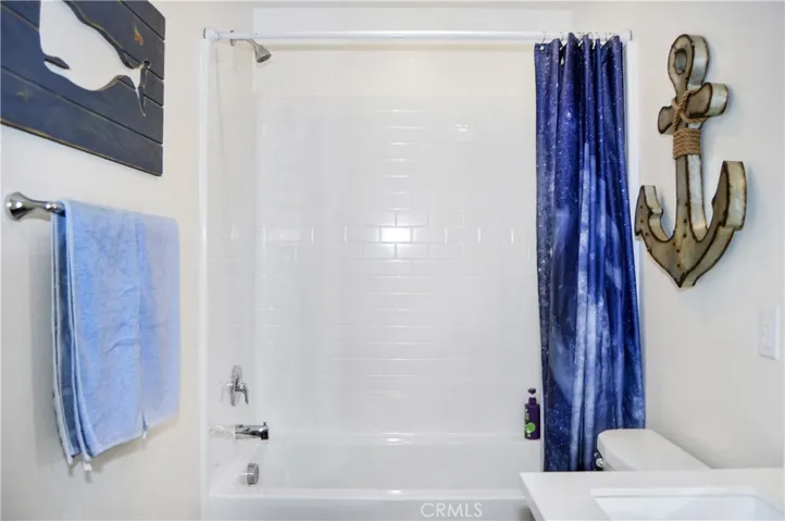 The 2nd bath is next to Bedroom #2 and has dual sinks, a tub/shower combo, and more luxury vinyl plank flooring