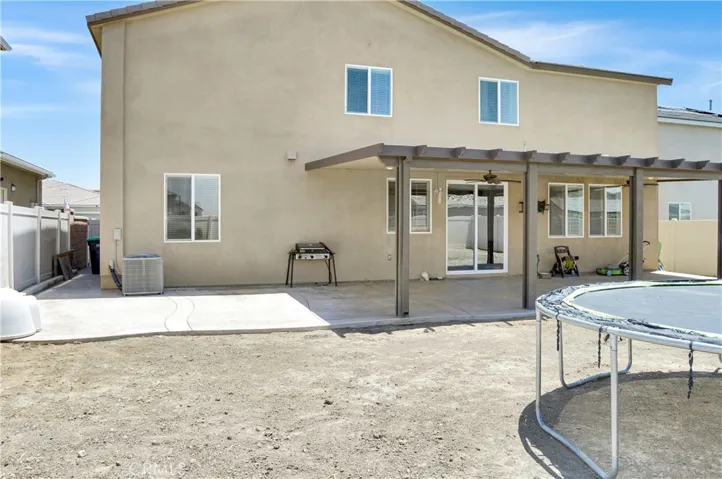 What a great backyard with an expansive stamped concrete patio partially covered by an AlumaWood cover with fans and recessed lighting and a nearly blank slate to landscape to your taste. Yes, this is a premium, pool-sized lot!