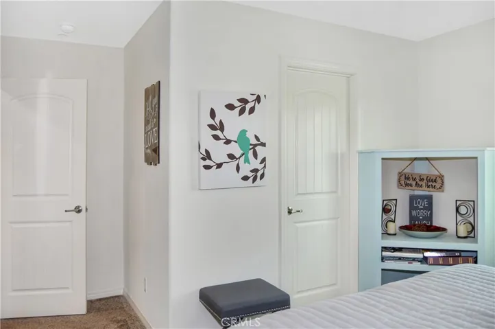 The 4th bedroom is right across from Bedroom #3 and offers nice views of the local hills to the south, a walk-in closet, a ceiling fan, and window blinds
