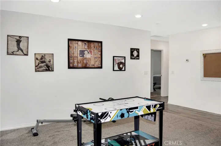 This loft space can serve so many purposes: a home gym, game room, theater room, play room, home office, or ?