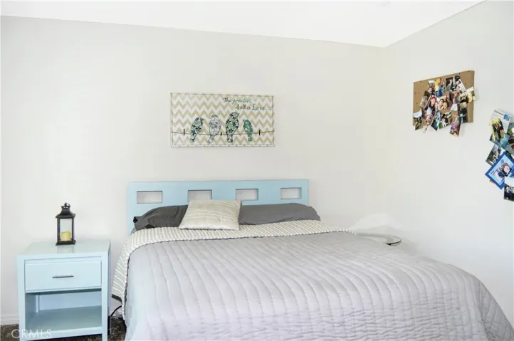 The 4th bedroom is right across from Bedroom #3 and offers nice views of the local hills to the south, a walk-in closet, a ceiling fan, and window blinds
