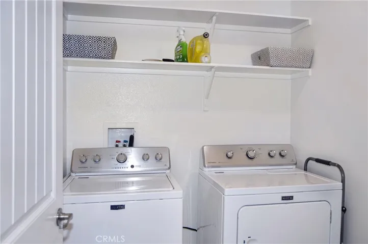 Yes! The laundry room IS upstairs and offers handy shelving and more luxury vinyl plank flooring