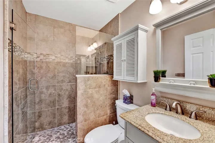 Primary bathroom with new surfaces.