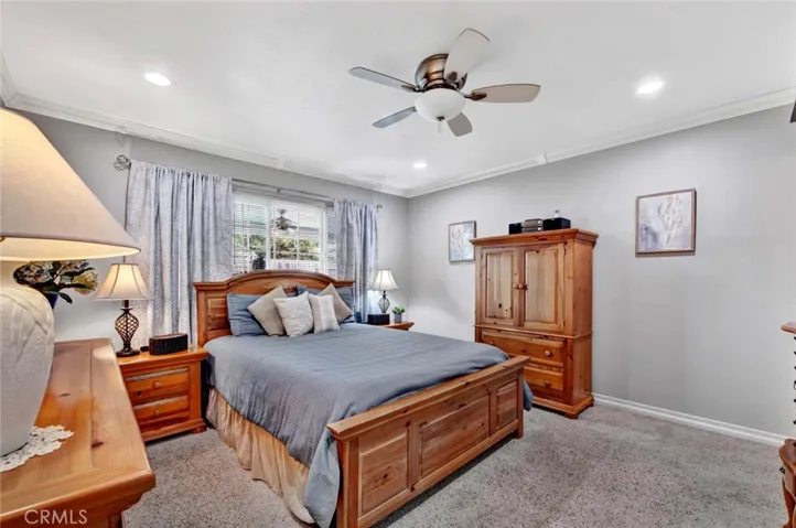 Primary room with carpet and large window.