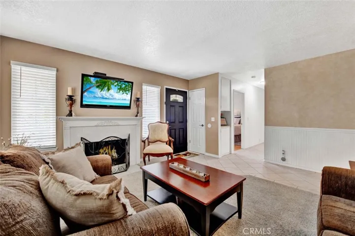 View of entry door and hallway leading to sleeping rooms.