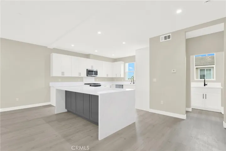 Open Kitchen with Large Waterfall Island