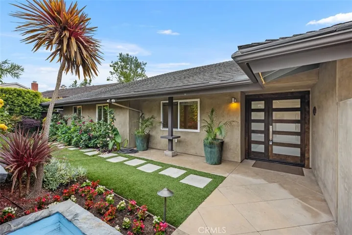 Lush landscaping shown in the front yard.