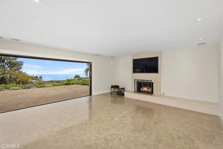 Open concept living room with bifold doors that open completely allowing the outside to be an extension to your living room.