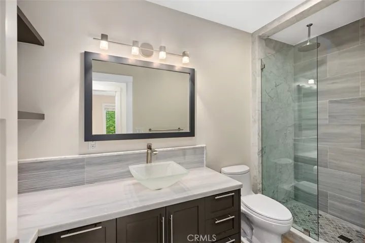 Guest bathroom with shower.