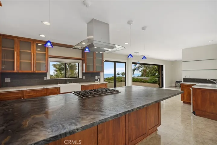 Leathered granite counters on the kitchen island and quartzite on the other counters.