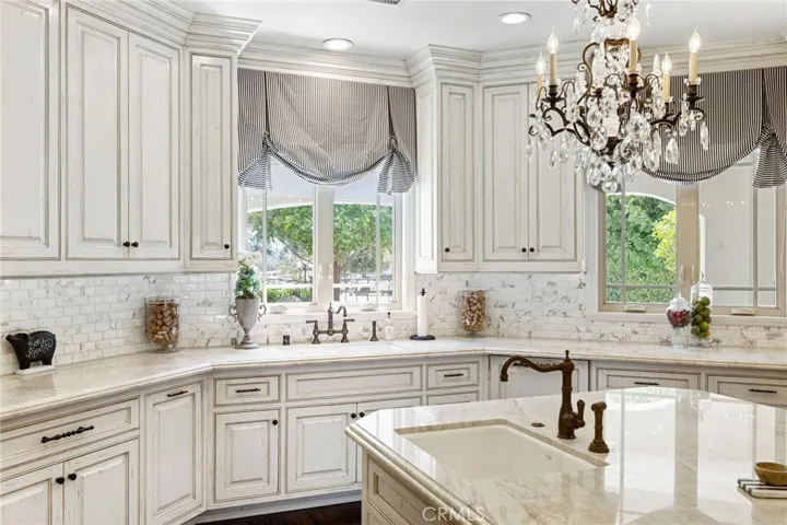 Kitchen window with a view of the front yard.