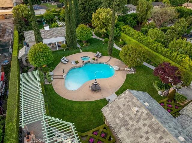 Aerial view of the backyard towards the pool house in the corner.