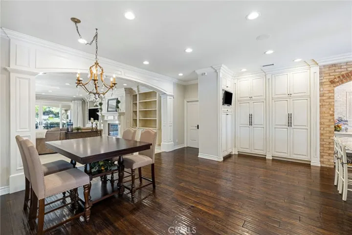Breakfast nook with a chandelier overlooking the family room.