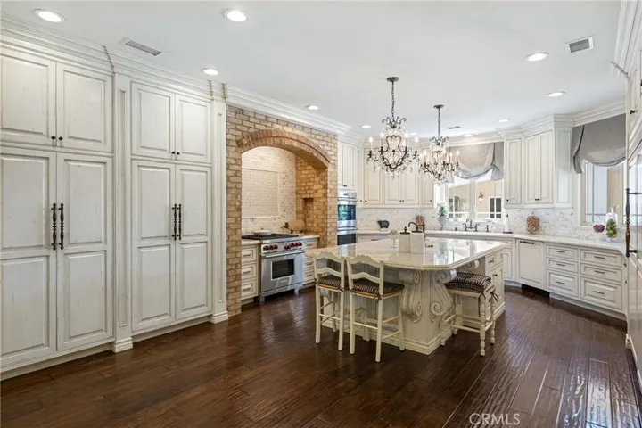 Custom kitchen with top of the line appliances and a center island.