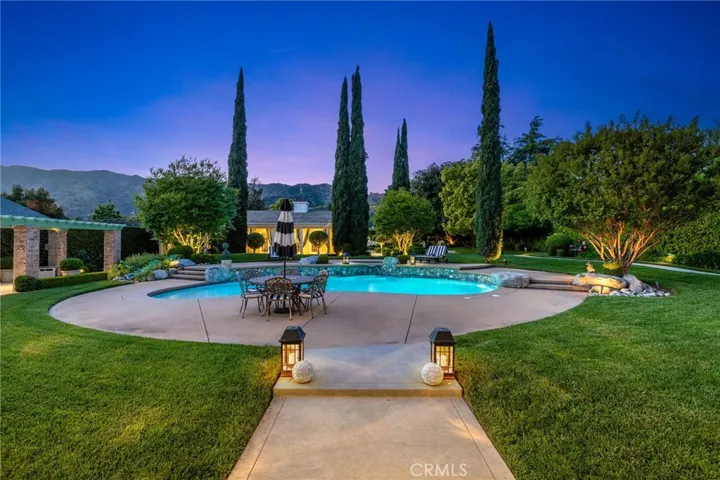 Pool and manicured grounds.