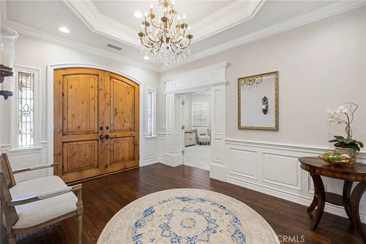 Foley with a tray ceiling, chandelier, and an office/library that could serve as a 4th bedroom inside the main home.