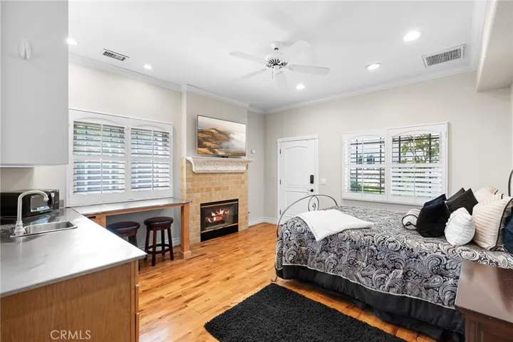 Interior of the casita with a fireplace and kitchenette.