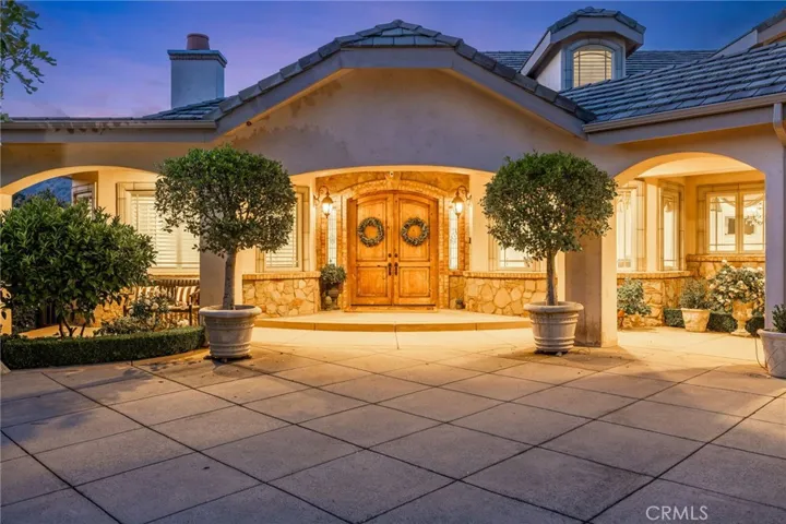 Covered front porch with double front entry doors.