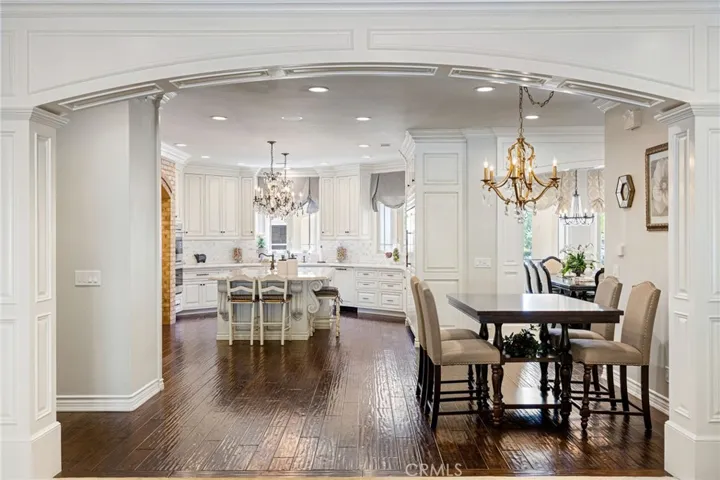 Arched paneling into the open kitchen.