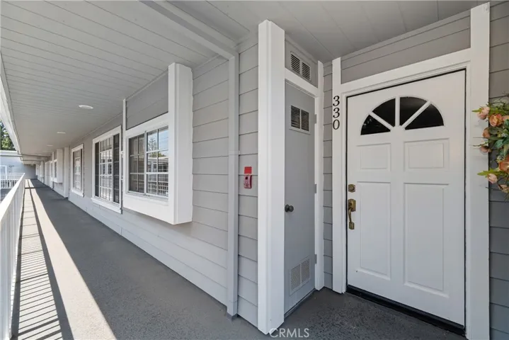 Front Door with Hallway to Elevator
