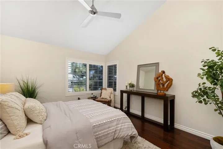 Primary Bedroom Corner Window Shutters and Harbor Views