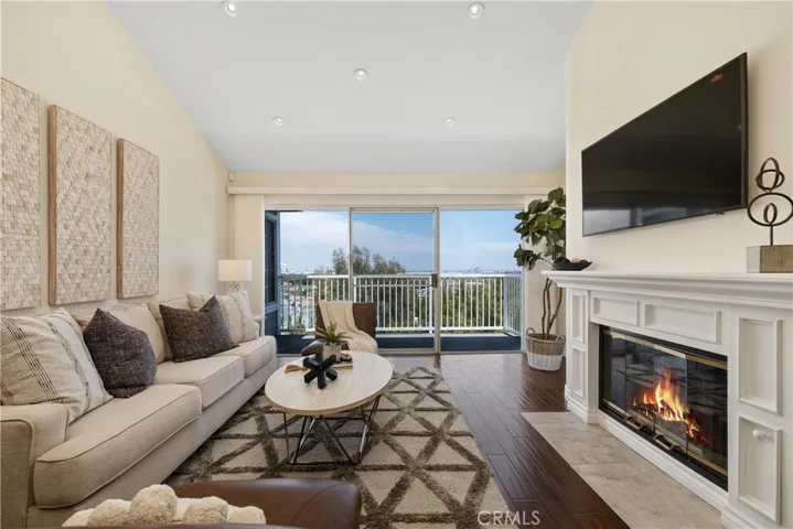 Living Room with Fireplace and Balcony
