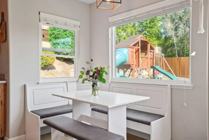 Breakfast nook with bench table for SIX that stays with the home.