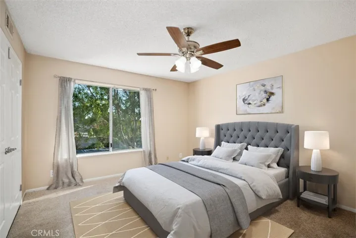 Master bedroom that has been virtually staged so you can get an idea of the layout of the room