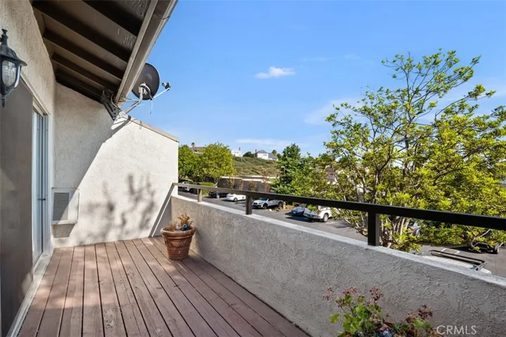 Balcony facing South East and views of the lush greenery and trees.