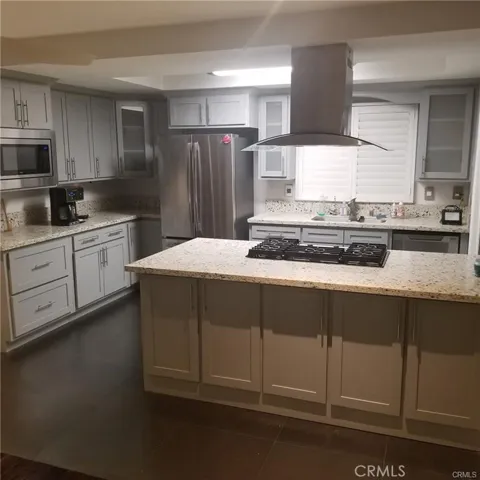 The kitchen is open to the dining room