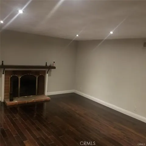 The family room comes with a wood burning fireplace