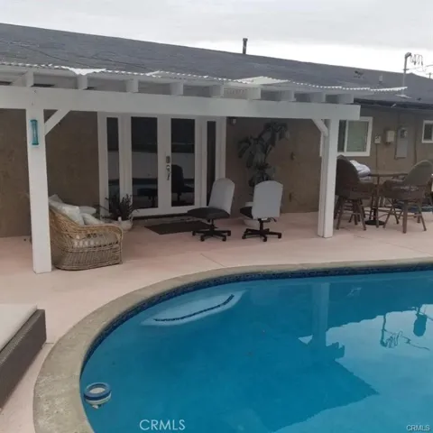 The backyard also has a nice shady space while relaxing in the pool area