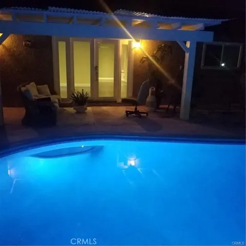 Here is a view of the pool lite up at night time