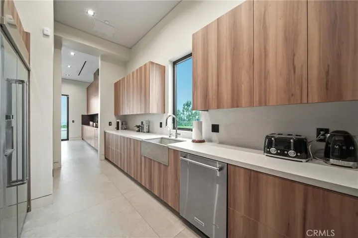 Hidden Chef's Kitchen has gas stove, refrigerator, dishwasher and lots of storage.