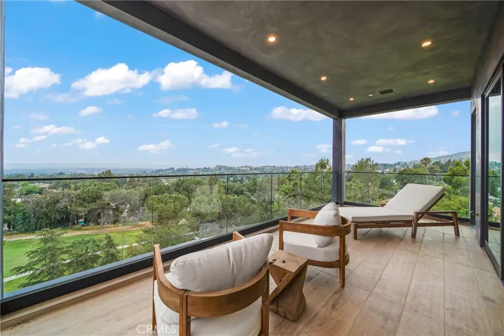 Balcony off of Primary Suite offering city and golf course views.