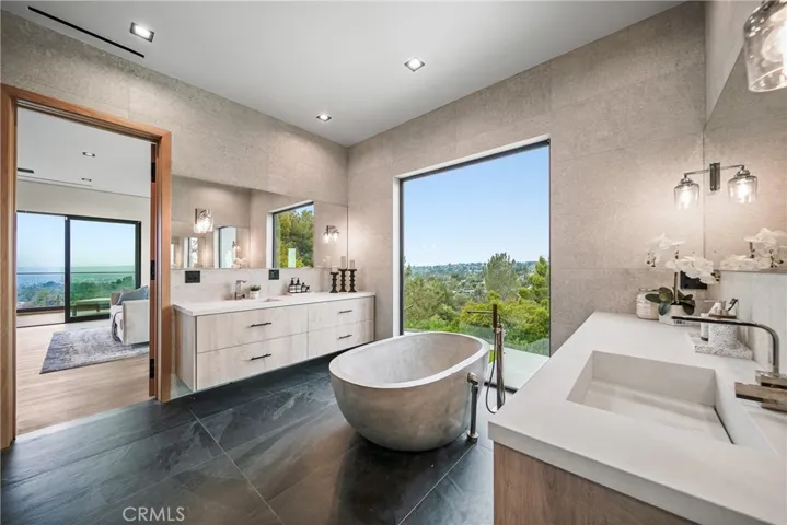 Primary Bath with  separate vanities.