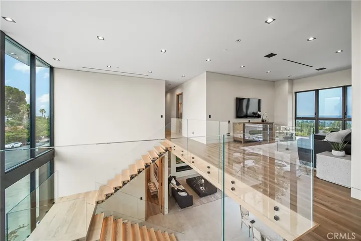 Make your way to the second level on the custom made floating staircase.