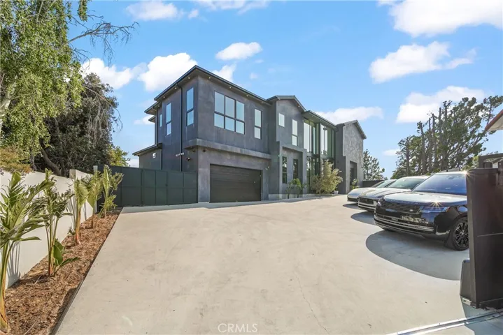 Behind the gate, sits this grand masterpiece with plenty of parking, for family and guests offering complete privacy.