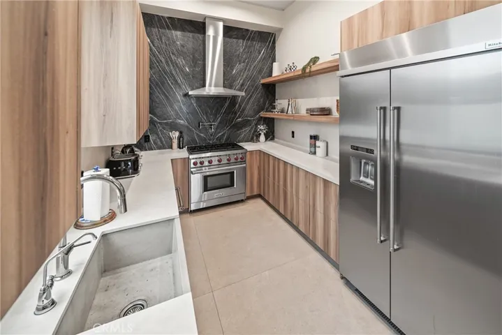 Hidden Chef's Kitchen has gas stove, refrigerator, dishwasher and lots of storage.