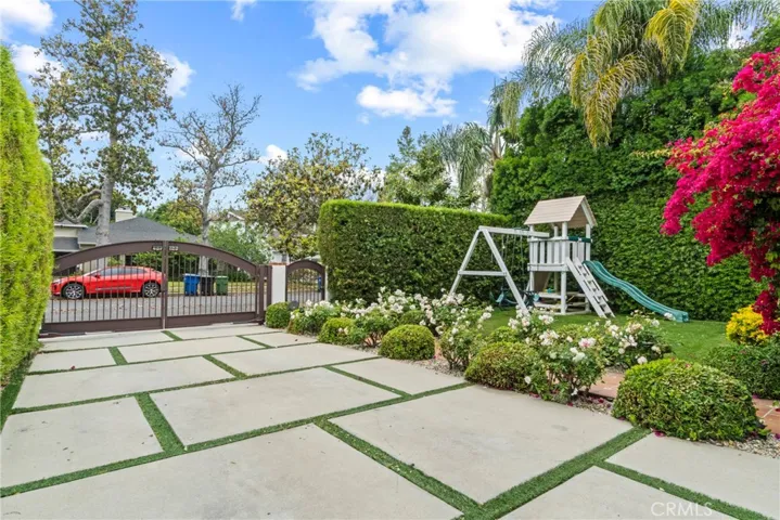 view of gated yard and driveway