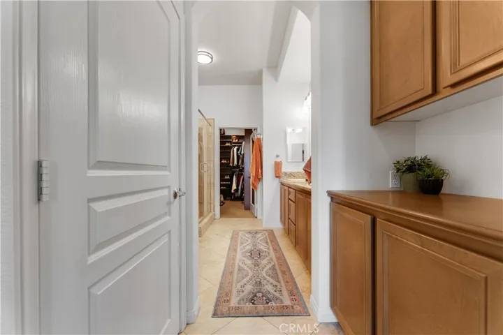 Water closet door on the left, and a great space on the right for storage or in-suite coffee station.