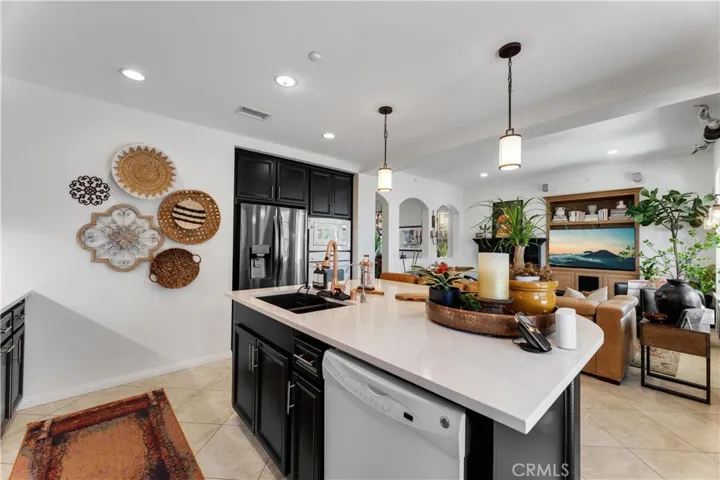 Kitchen opens to the living room with direct access to the patio