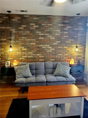 BEDROOM 1 WASHED BRICK WALL