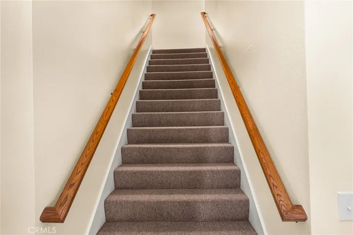 door to your garage at the base of these stairs. your unit front door is at the top of the stairs on the right