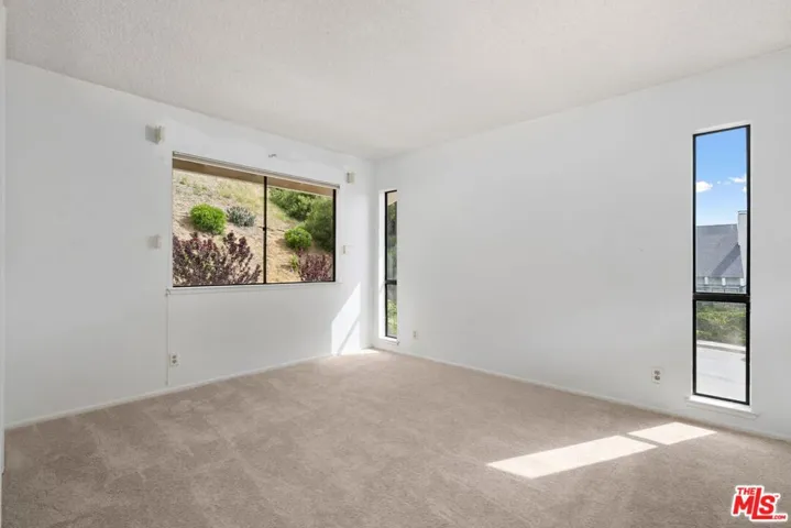 fourth bedroom with walk in closet