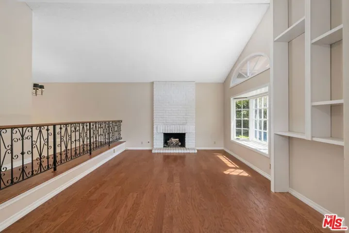 large living room with fireplace # 1 and vaulted ceilings