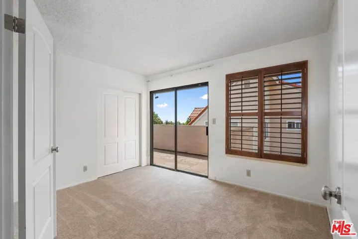 second bedroom with terrace and ocean views
